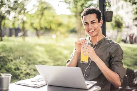 Business owner relaxing outdoors with time away from the desk
